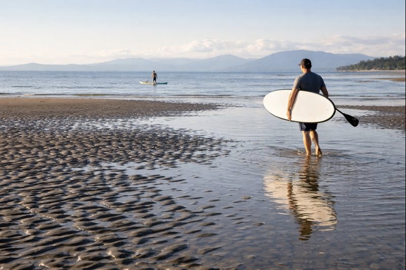 surfing at beach with professional paddleboarders 2023 Barnet Marine Park Day Trip Ideas in Burnaby, BC surfing at beach with professional paddleboarders
