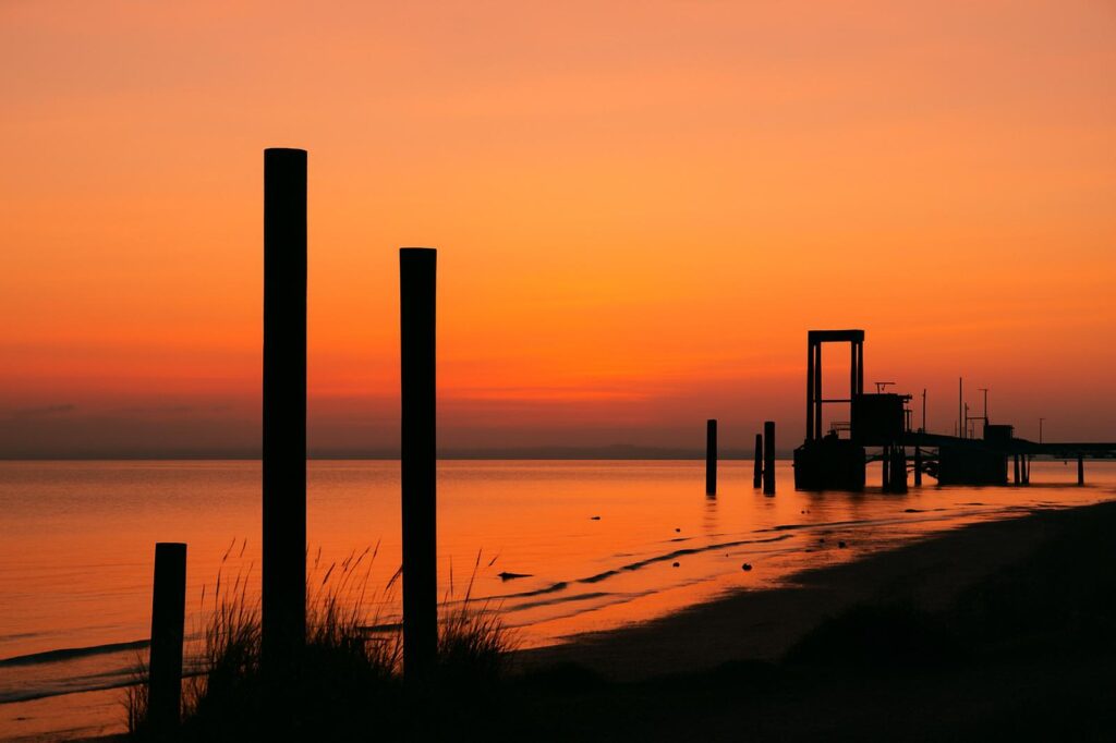 sunset at delta shore with pilings and water Burnaby BC Photo Spots: Beautiful Views sunset at burnaby shore with pilings and water