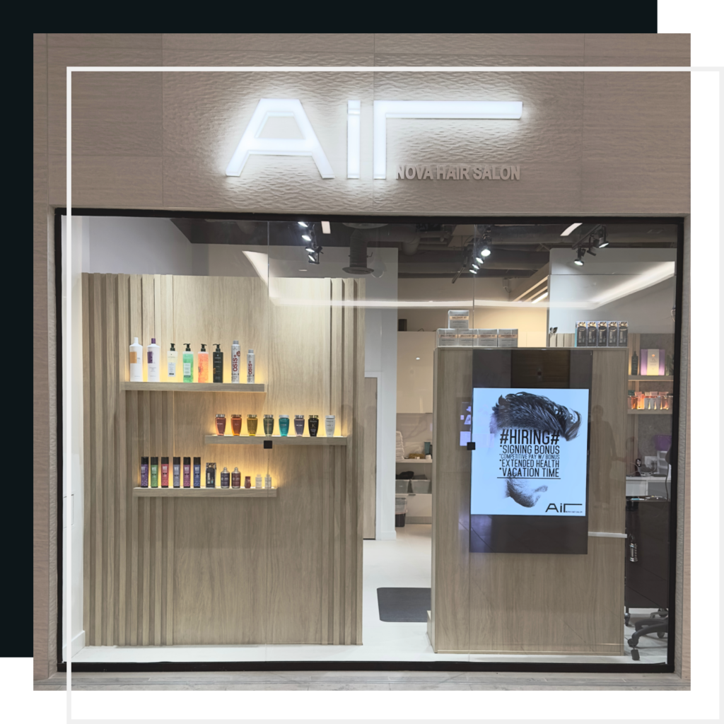 Air Nova Hair Salon storefront in Burnaby with illuminated signage and product displays