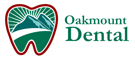 Oakmount Dental Burnaby logo featuring a tooth shape with mountain design in green and red