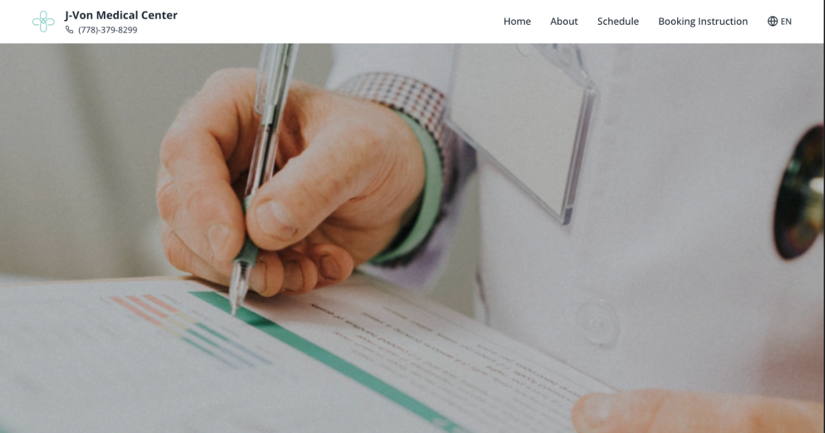 Healthcare professional writing on medical documents at J-Von Medical Center in Burnaby