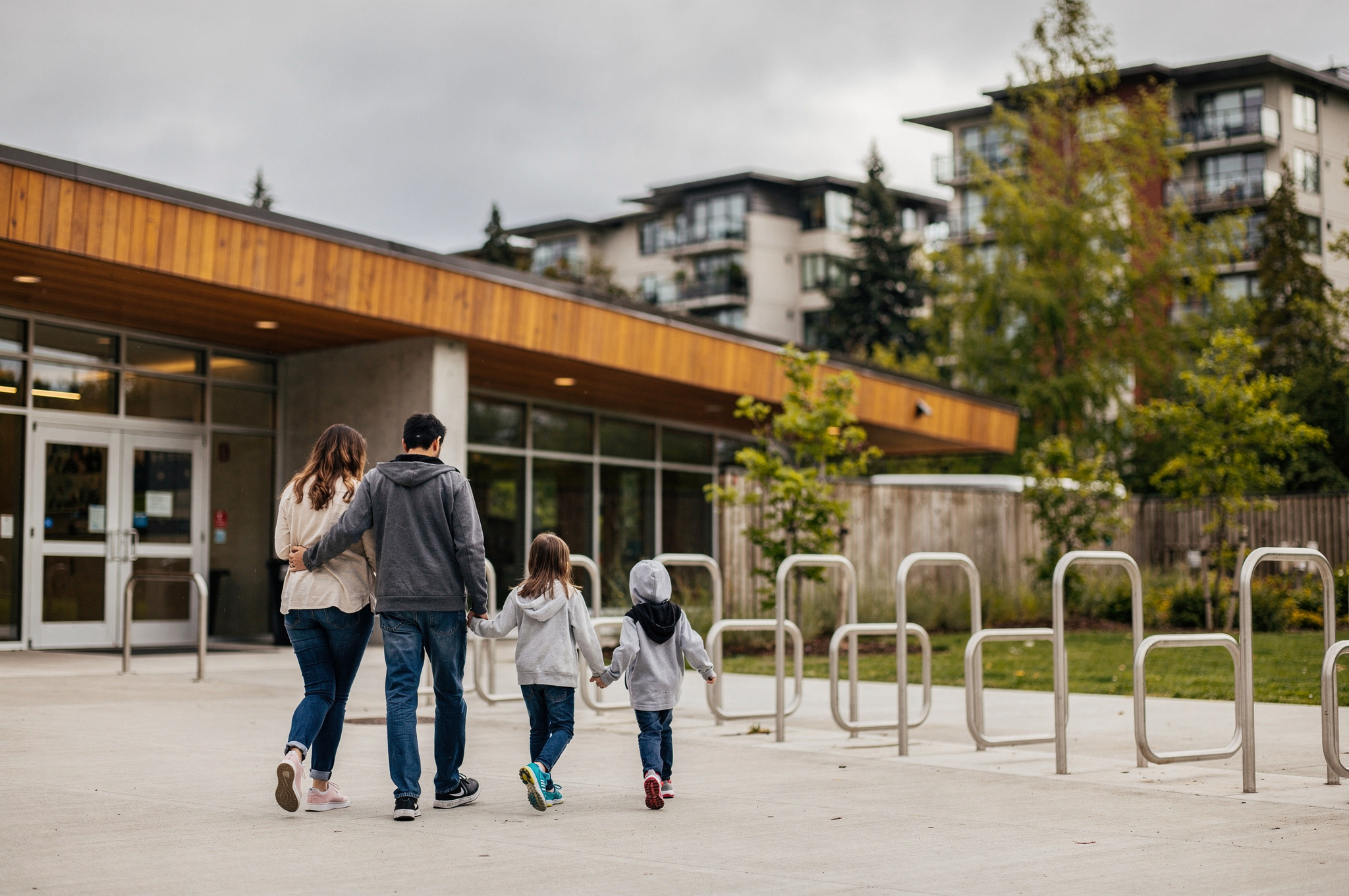 burnaby bonsor recreation centre family v2 Best Burnaby Community Centres, Pools, and Rec Facilities Family walking toward the entrance of a Burnaby recreation centre near Metrotown